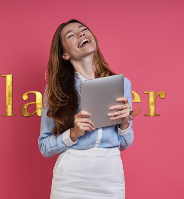 excited young woman holding digital tablet
